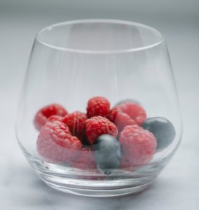 glass of fresh berries on table