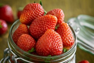 strawberry in glass fido jar